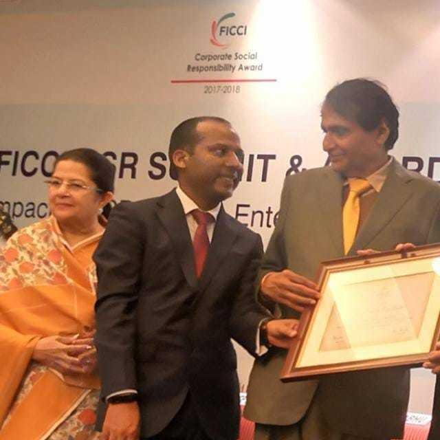 Tara Chand receiving FICCI CSR Award